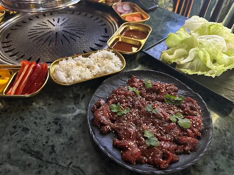 Wagyu on a grill with smoke